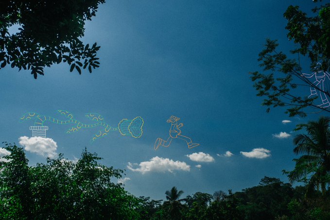 A bright blue sky framed by tropical trees features whimsical neon line art of a figure running along a swirling path of clouds and symbols, creatively visualizing the cheerful "Gm" (good morning) greeting as a morning sky scene.