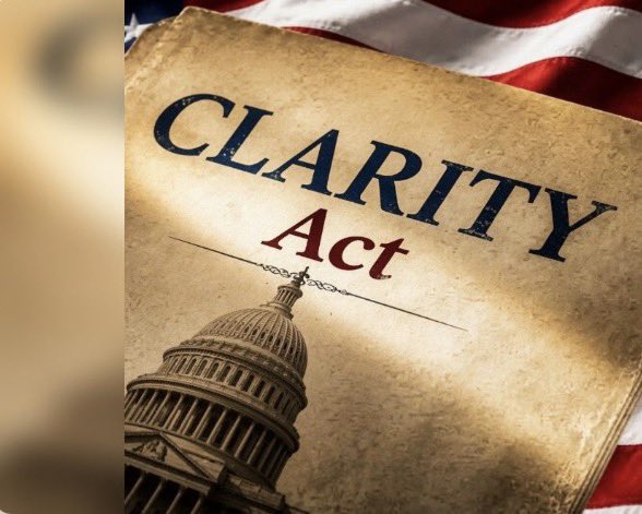 The image features a book titled "Clarity Act" with an American flag behind it, which has been edited to include the text "CLARITY" at the top of the book cover. The focus of this image is on the title of the book, and there are no other objects or texts present in the scene.