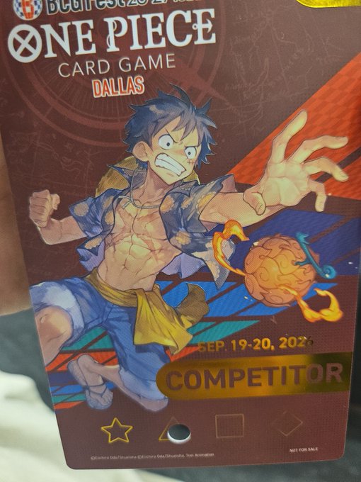 A 'ONE PIECE CARD GAME' competitor badge for Dallas featuring anime character Monkey D. Luffy, dated Sep. 19-20, 2025.