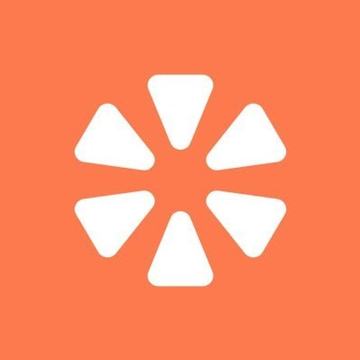 A simple logo on an orange background featuring six white triangular shapes arranged in a flower or starburst pattern.