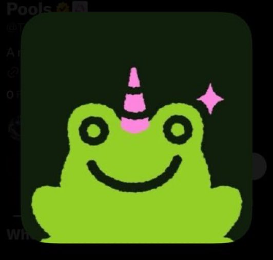 A digital avatar of a green cartoon frog with a pink unicorn horn and a sparkle, appearing as an app icon or logo.