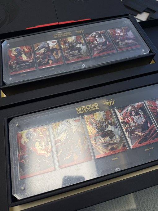 Two display cases containing 'Riftbound League of Legends' trading cards are shown, with cards labeled 'Katarina', 'Teemo', 'Faker', and 'Gumayusi' visible behind clear protective sleeves.