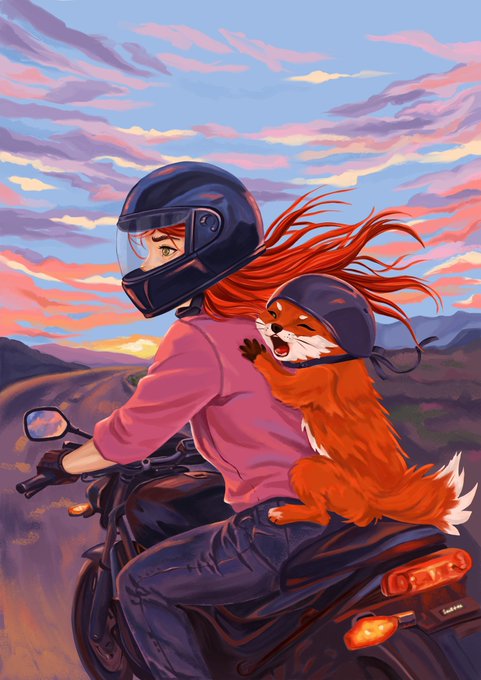 A digital illustration depicts a person with flowing red hair wearing a black motorcycle helmet and pink jacket riding a motorcycle, with a happy red fox wearing a matching helmet clinging to their back against a vibrant sunset landscape.