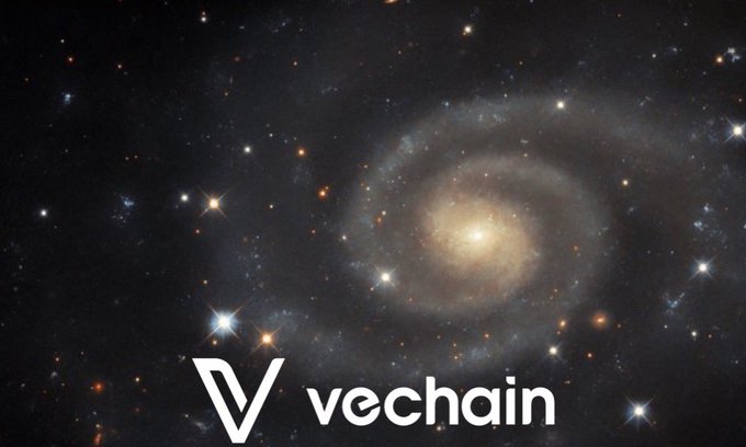 A spiral galaxy image with the VeChain logo and text "vechain" displayed at the bottom.