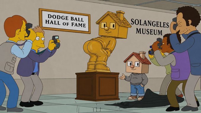 A scene from *The Simpsons* shows Bart Simpson, wearing a house on his head, posing next to a golden statue of a nude figure with a house for a head at the "Dodge Ball Hall of Fame" inside the "Solangeles Museum," while photographers crowd around to take pictures. The "Solangeles Museum" sign directly references the post's "good morning solangeles" greeting, tying the museum's location to the message.