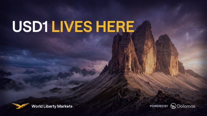 A promotional banner featuring a dramatic mountain peak at sunset displays the headline "USD1 LIVES HERE" alongside logos for World Liberty Markets and Dolomite, visually reinforcing the post's message that USD1 has a dedicated home for lending and borrowing through World Liberty Markets powered by Dolomite.