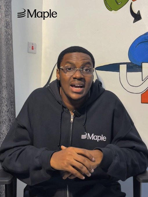 A man wearing a black Maple hoodie and glasses speaking to the camera, with the Maple logo in the top left corner and colorful cartoon artwork in the background.