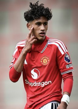 Manchester United player wearing the red home kit with Snapdragon sponsor, making a gesture near his face during a match.