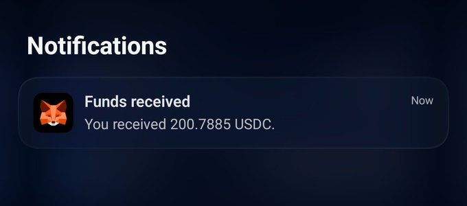 Mobile notification screen from a MetaMask wallet showing 'Funds received - You received 200.7885 USDC' with a fox icon and 'Now' timestamp.