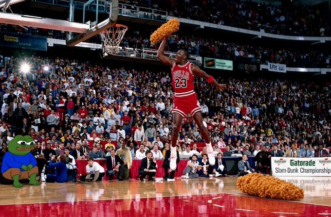 A digitally edited image showing Michael Jordan (#23, Bulls) soaring through the air during the Slam Dunk Championship, but with fried chicken replacing the basketball, alongside a cartoon Pepe the Frog character sitting courtside.