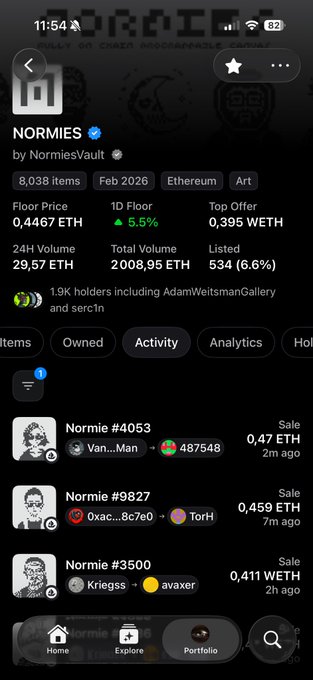 The image shows a phone screen displaying information about a cryptocurrency called "Norman's" with various details such as total volume, price, and market cap. The phone screen also has a feature that allows users to see who is selling or buying the cryptocurrency at any given moment. This can be helpful for tracking transactions and understanding the current state of the cryptocurrency market.