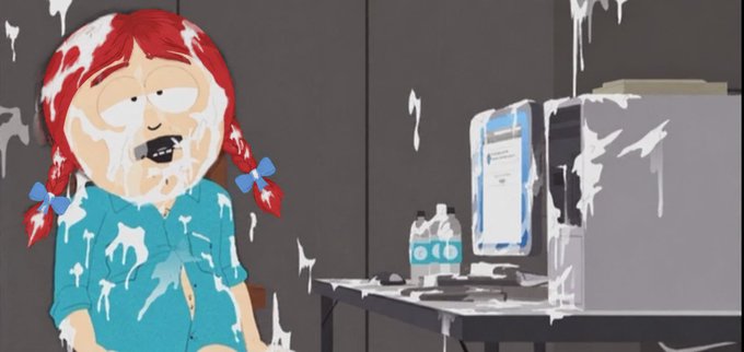 A cartoon image from South Park showing a red-haired character covered in what appears to be a white liquid splatter, sitting at a computer with water bottles nearby.