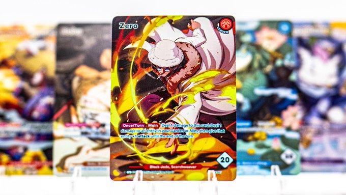 A close-up of a trading card featuring the character 'Zero' performing 'Aries: Snap Judgement' for 20 damage, displayed in front of a row of other cards.