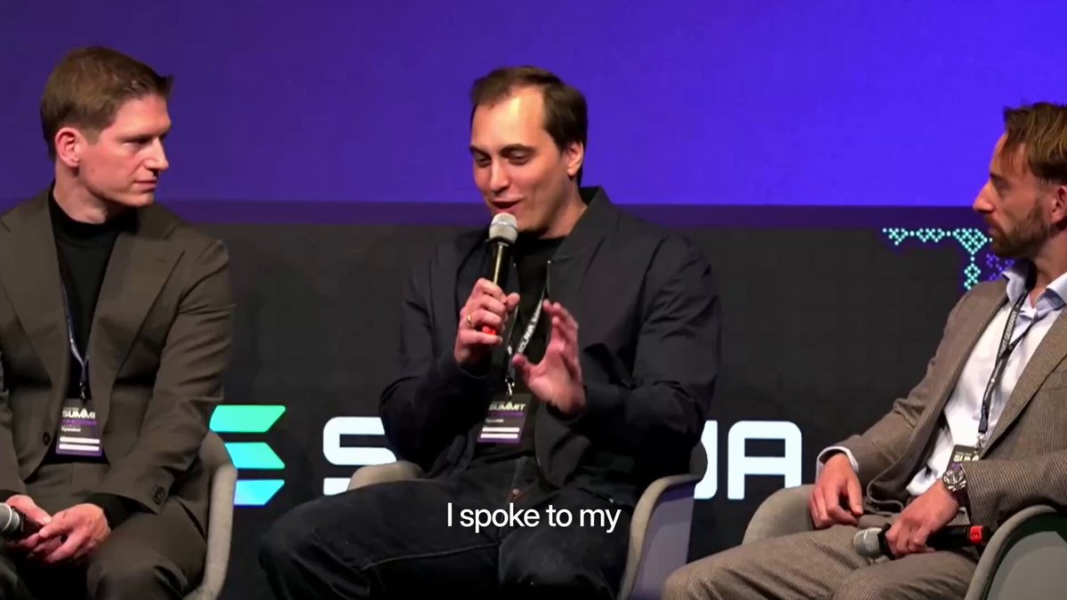 The image shows three men sitting around a table, with one man speaking into a microphone while the other two listen attentively. The background features a purple wall adorned with a logo for "Solana", suggesting that they are at an event related to cryptocurrency or blockchain technology. The caption of the image reads "@SuperteamDE Summit" and "@JonasKonstandin on why @MidasRWA is coming to Solana.", indicating that this gathering might be discussing the growth trajectory of RWA (Regional Wealth Advice) and stablecoins in relation to the Solana blockchain.
