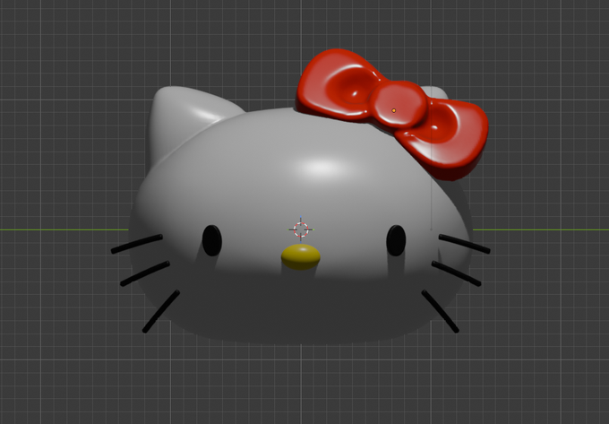 A 3D model of a Hello Kitty character head is displayed in a 3D modeling software viewport, featuring a gray cat-like face with a prominent red bow, yellow nose, black whiskers, and simple black dot eyes. The model's transform gizmo is visible near the nose area, set against a dark gray grid background.