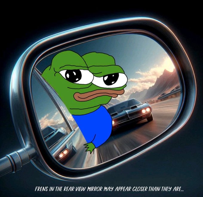 A meme showing Pepe the Frog in a rearview mirror with two cars chasing behind, captioned 'FRENS IN THE REAR VIEW MIRROR MAY APPEAR CLOSER THAN THEY ARE...'