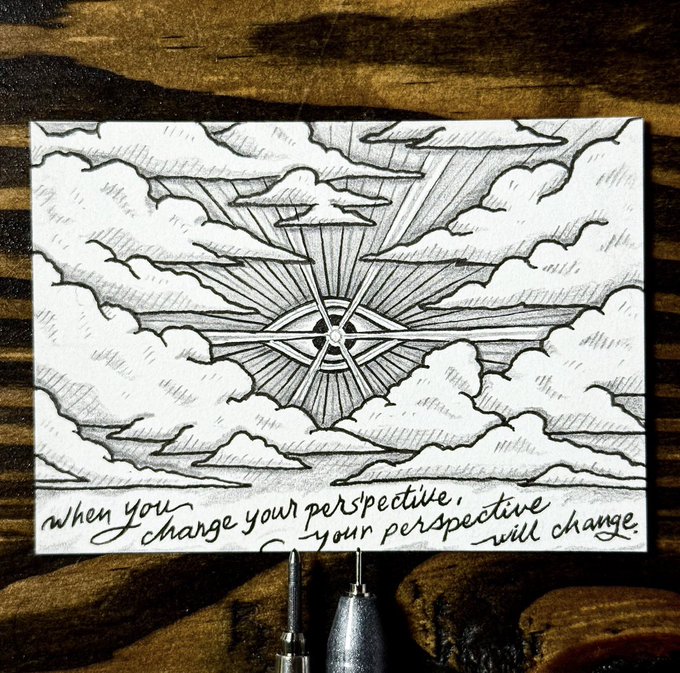 A black-and-white ink sketch of clouds surrounding a compass rose, with the handwritten text 'when you change your perspective, your perspective will change.'