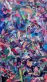 An abstract, colorful artwork with dense brushstrokes in shades of blue, purple, pink, and teal, creating a textured, impressionistic pattern.