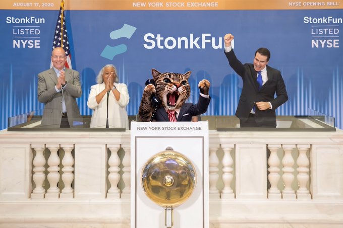 A photoshopped scene showing people at the New York Stock Exchange podium, with a cat's head and paws superimposed over one person, and banners reading 'StonkFun LISTED NYSE'.
