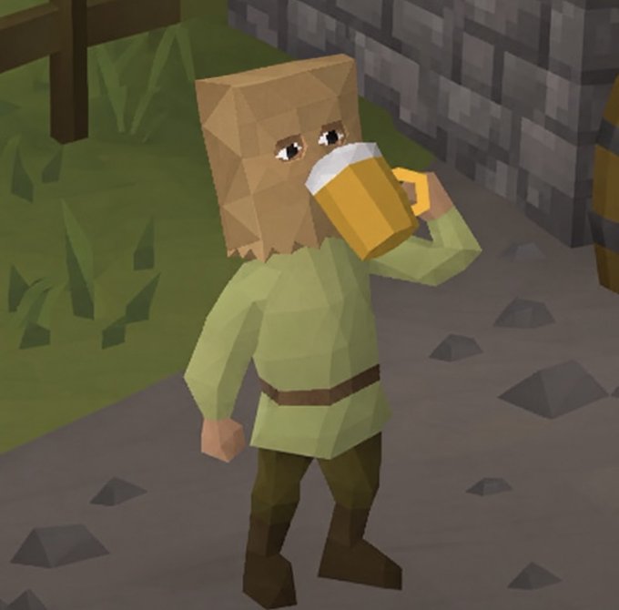 A 3D rendered character from a low-poly video game standing on a stone path. The character wears a green tunic and brown pants, has a paper bag over their head with drawn-on crying eyes, and is drinking from a large mug of beer.