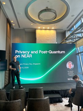 A conference presentation showing a speaker on stage in front of a large screen displaying 'Privacy and Post-Quantum on NEAR,' dated February 8, 2025, in Singapore.