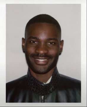 A smiling man with a short beard wears a dark zip-up jacket with a patterned collar, posed for a portrait photo. The "POV: Me selling keys" caption combined with the "Robin robbed the hood" punchline plays on his friendly, approachable look—implying he's the unassuming "Robin Hood" figure cheerfully handing out the goods.