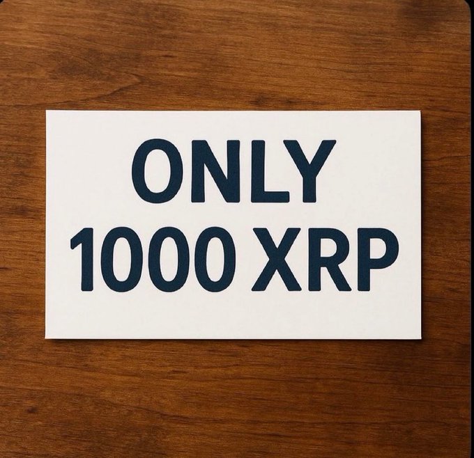 The image shows a white sign with black text that reads "Only 1000 $XRP". This suggests that there might be an offer for a limited time, possibly related to Bitcoin or another digital currency. The sign is placed on top of a wooden surface, which could indicate that it's being displayed at a store or event where people can interact and learn more about the product or service being offered.