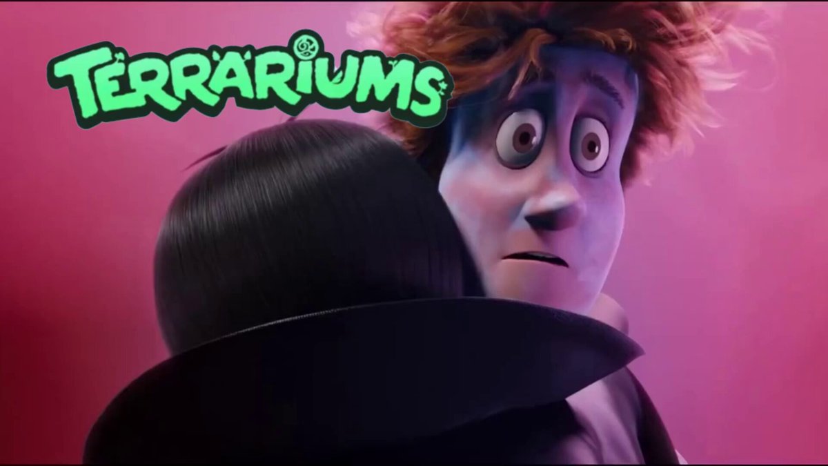 The image features a poster for "Terraiiums" with two characters from the movie hugging each other. The text on the poster reads "Terraiiums". Below this, there are some descriptions of the characters' appearances. One character is described as having red hair and wearing a black top hat, while the other character has blue hair and is dressed in a purple outfit. The poster also mentions that the rewards for watching the movie will be turned off at 2 PM VN time on Saturday, 12 June.