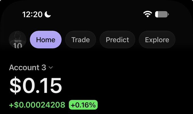 A mobile app screen showing an account balance of $0.15 with a slight increase of +$0.00024208 (+0.16%), featuring navigation tabs for Home, Trade, Predict, and Explore.