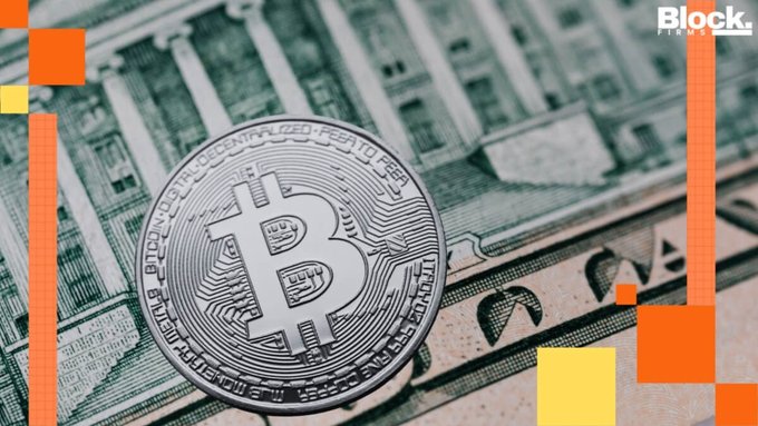 A close-up of a physical Bitcoin coin resting on U.S. dollar bills, with a 'Block.' logo in the upper right corner.