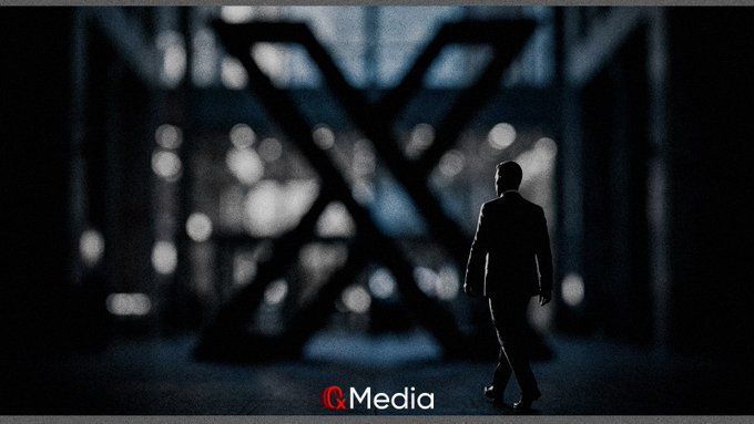 A silhouetted figure in a suit walks toward a large illuminated X-shaped structure in a dark industrial setting, with 'Q Media' logo displayed at the bottom.
