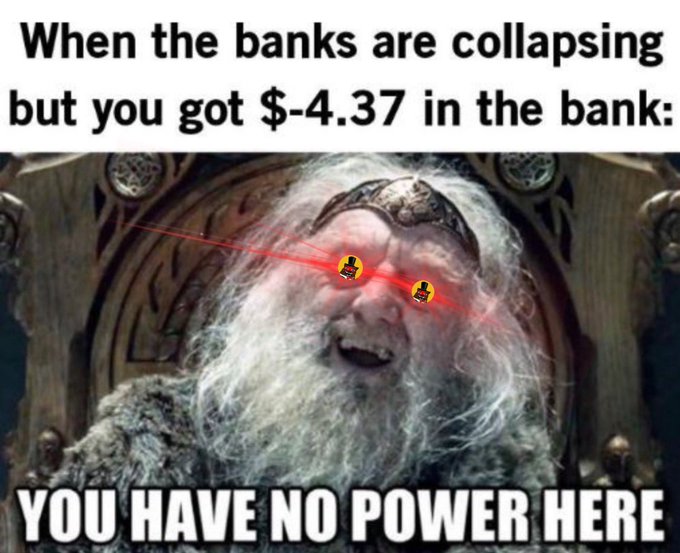 The meme shows a wizard-like character (King Théoden from Lord of the Rings) with glowing red laser eyes, edited to look like he's smirking with a sense of detachment. The top text reads "When the banks are collapsing but you got $-4.37 in the bank:" while the bottom bold caption declares "YOU HAVE NO POWER HERE," humorously suggesting that since the person's account is already in the red, the bank's financial troubles have no impact on them. The accompanying post references $BEAR and $XRP/#XRPL, tying in crypto tokens as an alternative to traditional banking, reinforcing the meme's theme of being unaffected by conventional financial crises.