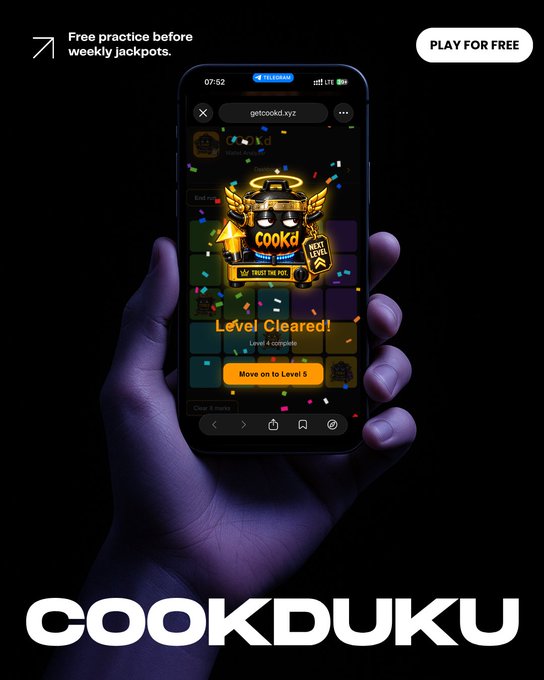 A promotional ad for "COOKDUKU" shows a hand holding a smartphone displaying a "Level Cleared!" screen for a free puzzle game, with text "Free practice before weekly jackpots" and a "PLAY FOR FREE" button.