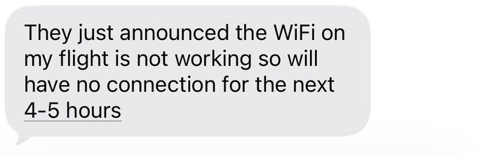 A flight passenger expresses frustration in a text message about their Wi-Fi being out for the next 4-5 hours, which they appear to be sarcastically celebrating as "we're so back."