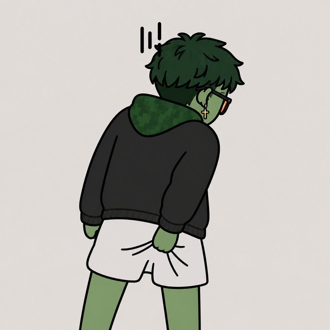 A cartoon-style illustration shows a green-skinned character from behind, wearing a black jacket with a pixelated green hood, white shorts, and a cross earring, displaying a startled reaction.