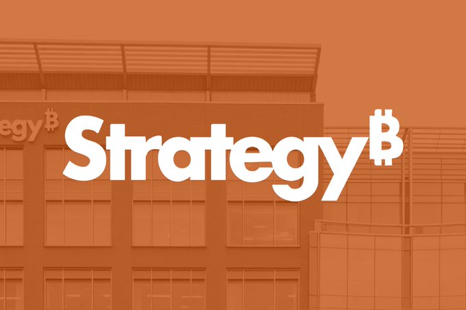 An orange-tinted promotional image showing a building facade with the white 'Strategy₿' logo prominently displayed across the center.