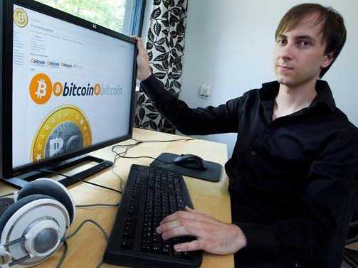 A young man sits at a computer displaying Bitcoin.org, with a keyboard and headphones nearby, while the accompanying post notes that developer Martti Malmi's first fiat Bitcoin trade took place 17 years ago when he sold 5,050 BTC for just $5, a stark contrast to Bitcoin's value today.