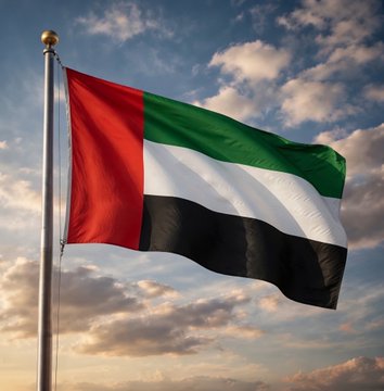 The image shows the flag of the United Arab Emirates waving against a dramatic sky, symbolizing the nation behind the UAE PASS integration of Avalanche into its digital identity system. The national flag reinforces the announcement that the UAE is leveraging blockchain technology for secure, verified document sharing.