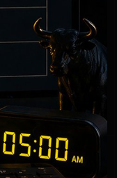 A dark silhouette of a bull statue sits atop a glowing digital clock displaying "05:00 AM," visually reinforcing the bullish sentiment referenced in the post about $ANSEM. The bull imagery serves as a strong symbol of market optimism and upward momentum for the ticker.