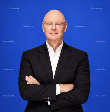A professional portrait of an older bald man with glasses wearing a black suit jacket over a white shirt, posing with arms crossed against a blue background featuring 'Polymarket' branding and logos repeated across it.