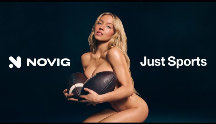 Sydney Sweeney is featured in an advertisement for the sports betting app Novig, holding two footballs. The words "Novig" and "Just Sports" are prominently displayed.