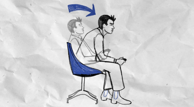The image features a cartoon depiction of a man sitting in an office chair, holding a remote control as if he's about to change channels or adjust the volume. The background shows a crumpled piece of paper with a blue arrow pointing towards the man. The text "new day new month same grind" is written on this paper, which seems to be related to the cartoon scene.