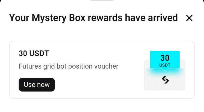 A Mystery Box rewards pop-up announces “30 USDT,” described as a “Futures grid bot position voucher,” with a black “Use now” button and a cyan 30 USDT voucher graphic.