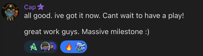 A Discord message from user 'Cap' with a pirate emoji, reading 'all good. ive got it now. Cant wait to have a play! great work guys. Massive milestone :)' with reaction emojis below.