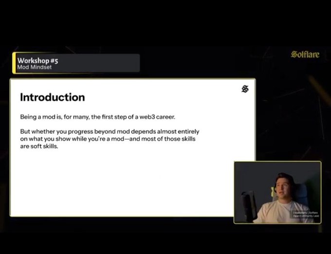 The image shows a presentation screen with a man sitting at a desk, likely participating in an online workshop or webinar. The main focus of the image is a slide from the workshop titled "Introduction" that reads "Being a mod is for many the first step of a web3 career." This statement seems to be about the importance of understanding and adapting to new technologies like Web3.