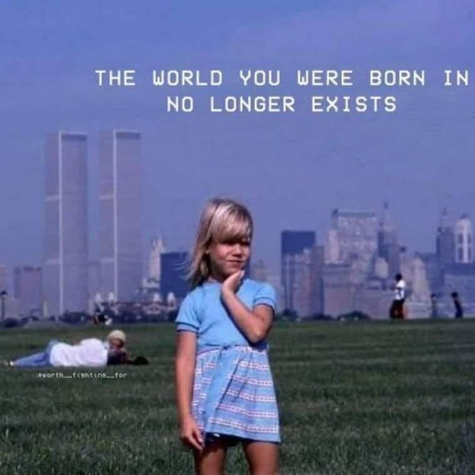A young girl with blonde hair stands on a grassy field with the New York City skyline in the background, overlaid with the text 'THE WORLD YOU WERE BORN IN NO LONGER EXISTS.'