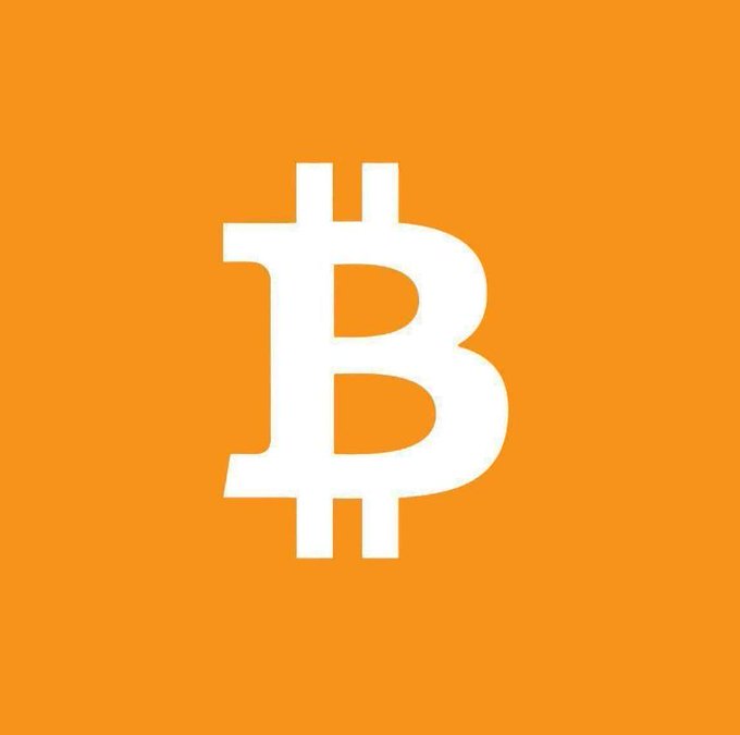A bold Bitcoin (₿) logo in white against a vibrant orange background, symbolizing the cryptocurrency's rise from its humble beginnings to its current prominence as a major global asset.