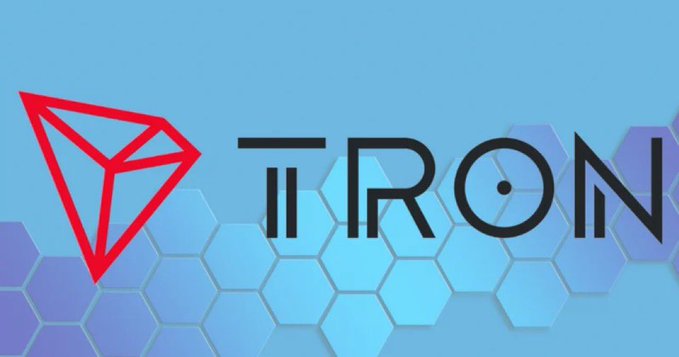 The TRON cryptocurrency logo featuring a red geometric diamond/triangle icon next to the word 'TRON' set against a blue hexagonal background.