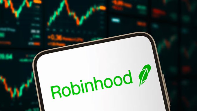 The Robinhood logo displayed on a white smartphone screen, set against a blurred background showing a financial chart with red and green lines.