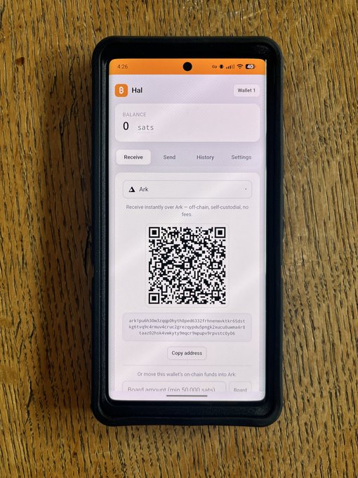 A smartphone displaying a Bitcoin wallet app (Hal) with a balance of 0 sats, showing a QR code and Ark address for receiving funds off-chain.